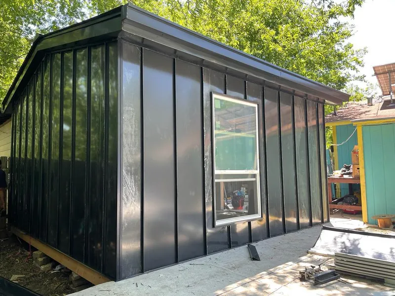 Black standing seam metal wall panels for Metal Roof Installation in Dexter